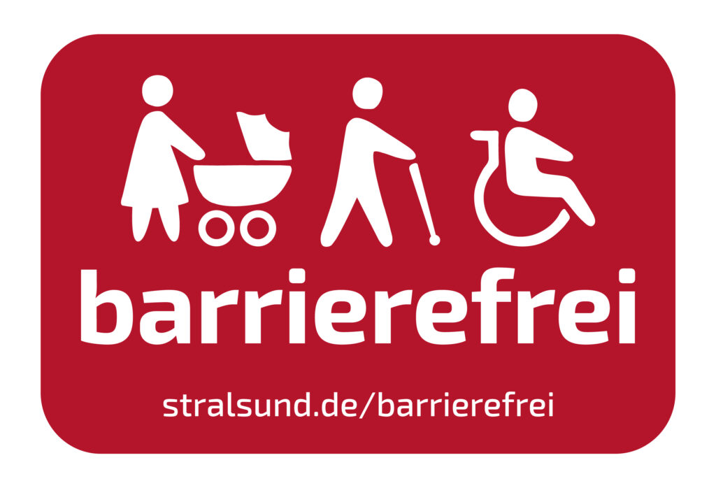 Plakette "barrierefrei" rot weiße Grafik: Person mit Kinderwagen, Person mit Gehstock, Person im Rollstuhl.